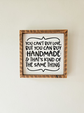 9x9 You can't buy love but you can buy handmade sign.